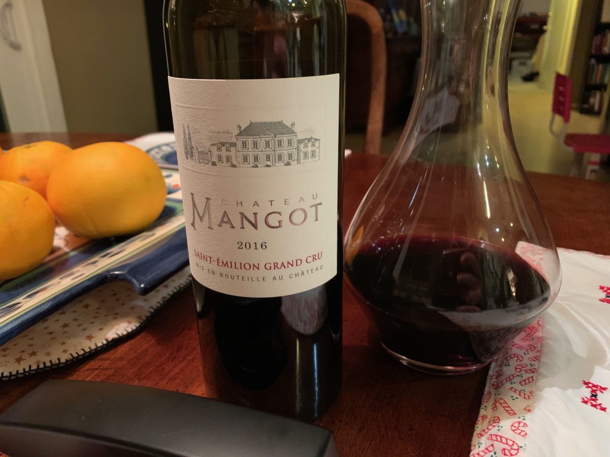 bottle of chateau mangot wine with carafe