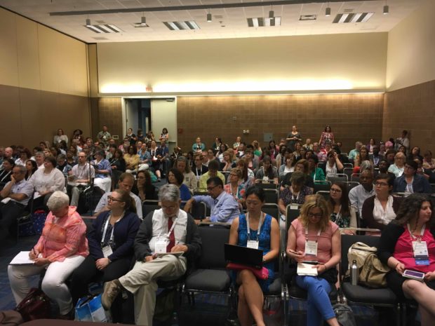 crowd of librarians sitting in conference hall at ALA annual 2018