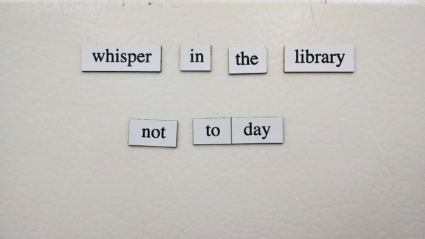text on a magnetic board that reads "whisper in the library not today"