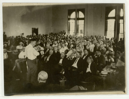 black and white photo of people assembled in a court room