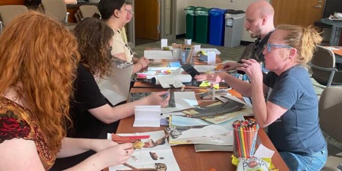 students working on zines