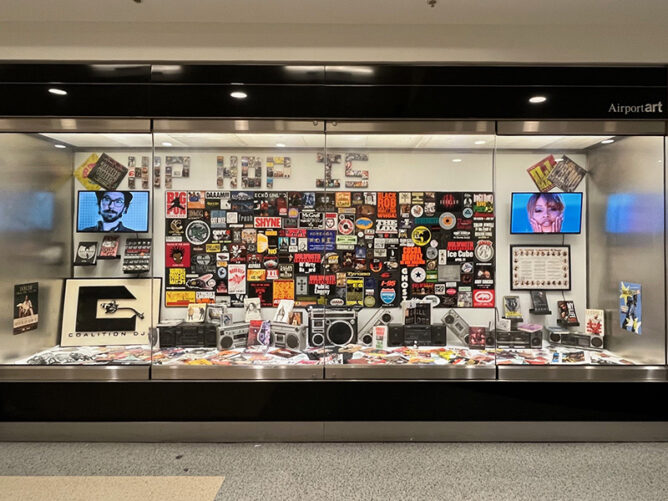 Hip hop exhibit in airport. Collage of art and albums.