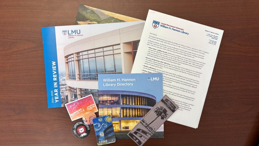 sample of items in the welcome packet that include bookmarks, magnets, stickers, a letter, and the library report