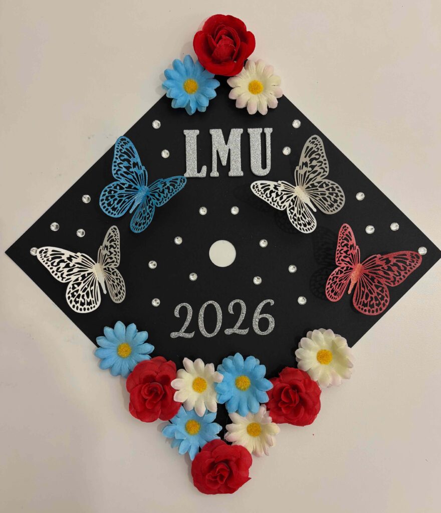 decorated mortar board hat with flowers and butterflies